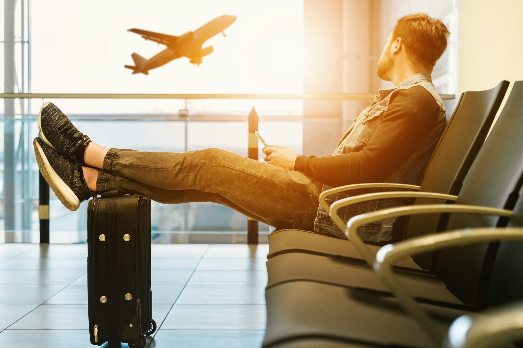 Traveler arriving at airport with luggage, ready for a private layover tour
