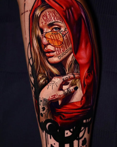 A tattoo artist from Los Angeles; a tattoo depicting a woman wearing a hood and orange aviator sunglasses, with Russian text on her face, wearing a red hooded dress; by Andrei Kolbasin, 998
