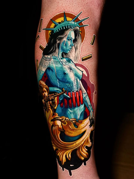Tattoo artist in Los Angeles, Statue of Liberty inspired female figure tattoo with turquoise skin, crown, red ammunition belt and ornate gold framing on the forearm, by Andrey Kolbasin, 991