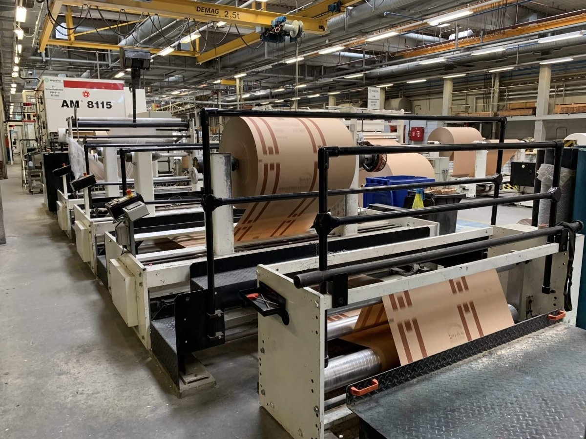 Quality specialist inspecting paper-converting line output