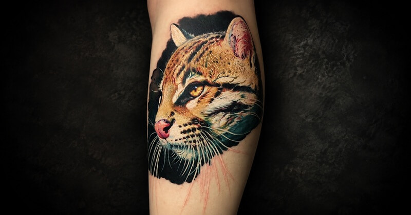 Realism tattoo — hyper-detailed leopard portrait