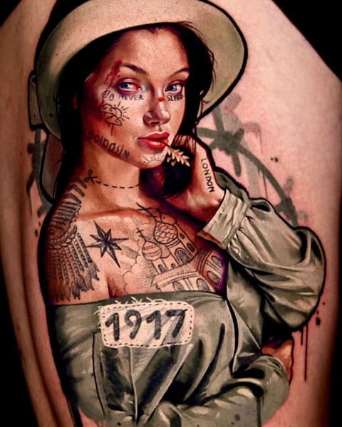 A tattoo artist from Los Angeles; a tattoo depicting a dark-haired woman with blue eyes, a straw in her mouth, wearing a hat and vintage clothing, with the inscription ‘1917’ on her shoulder; by Andrei Kolbasin, 997